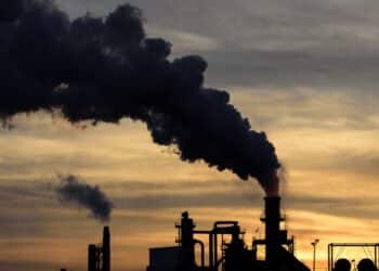 Industrial plant with black smoke