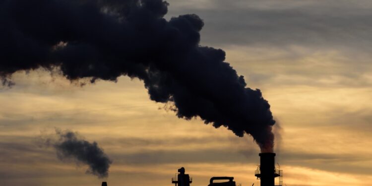 Industrial plant with black smoke
