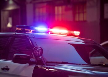 Photo of police car with red and blue sirens on top