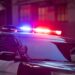 Photo of police car with red and blue sirens on top