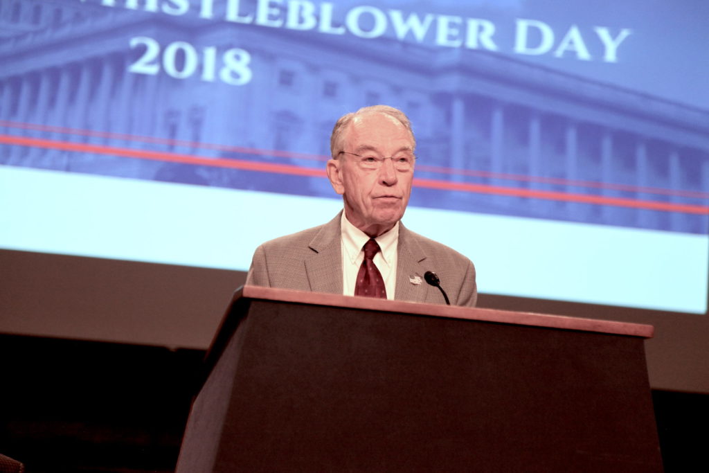 Photo of Chuck Grassley at a podium at the 2018 National Whistleblower Day celebration