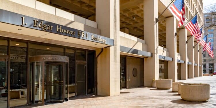 Image of the exterior of the J. Edgar Hoover building with American flags in Washington, DC