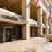 Image of the exterior of the J. Edgar Hoover building with American flags in Washington, DC