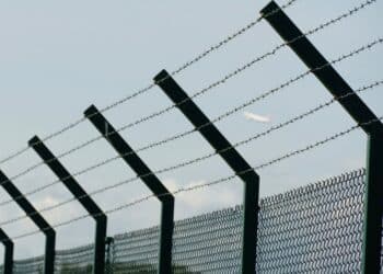 Barbed wire fence with slanted upper part pointing inwards