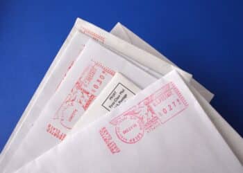 Photo of a small pile of postmarked letters