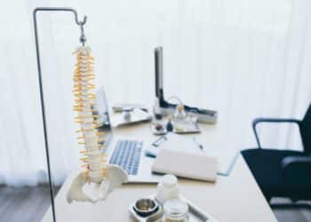 Photo of a doctor's desk with a model of a spine