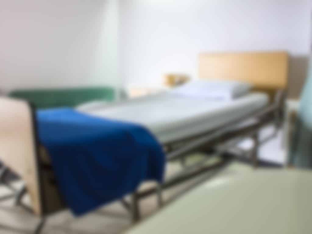 Blurred photo of a hospital/caretaking bed