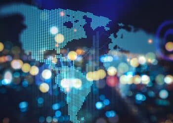 Map of the world overlaid on blurry lights