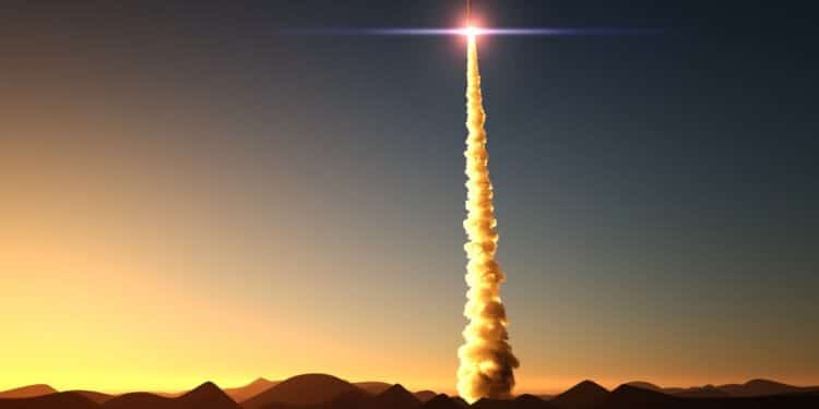 Stock photo of a rocket launching at sunrise in the desert.