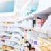 Row of medicines on shelves in a pharmacy