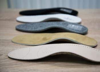 A variety of shoe inserts of different shapes and colors