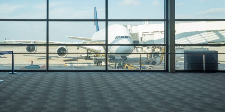 Airplane outside of an air terminal