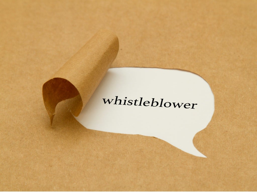 Image of the word "whistleblower" on white paper