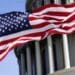 American flag in front of the U.S. Capitol building