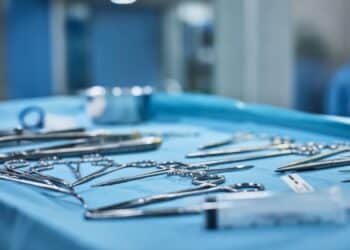 Close up of surgical tools on a table in an operating room