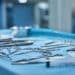 Close up of surgical tools on a table in an operating room