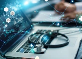 Photo of a laptop with a stethoscope on the keyboard