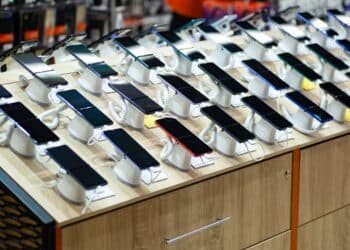 Photo of numerous smartphones on display in a store