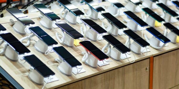 Photo of numerous smartphones on display in a store