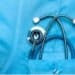 Close-up of a stethoscope in the pocket of a doctor's scrubs