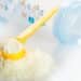 Baby formula with a yellow scoop and a baby bottle