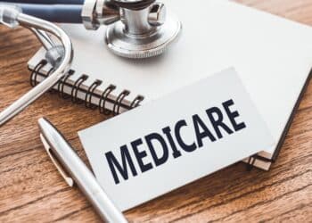 Medicare image with notebook and stethoscope