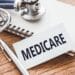 Medicare image with notebook and stethoscope