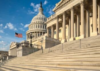 Photo of the U.S. Capitol Building against a blue sky