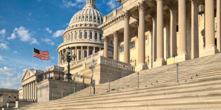 Photo of the U.S. Capitol Building against a blue sky