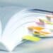 Close-up of a book with sticky tabs sticking out of the bottom