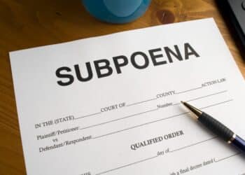 Subpoena form with a pen on a desk
