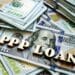 Words "PPP" loans on a pile of $100 bills