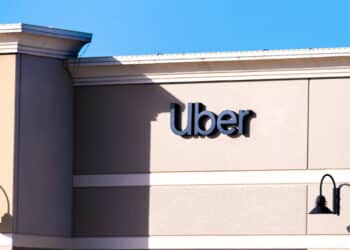 Orlando, USA - January 16, 2021: Florida city with closeup of sign and entrance to building for Uber business company office