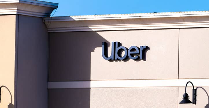 Orlando, USA - January 16, 2021: Florida city with closeup of sign and entrance to building for Uber business company office