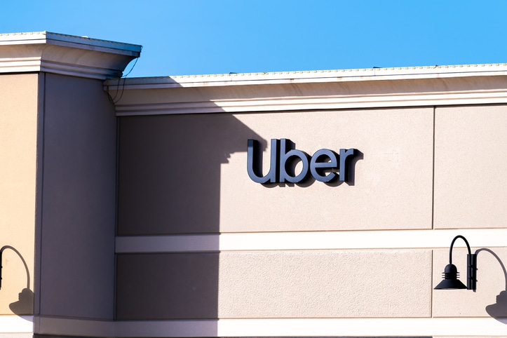 Orlando, USA - January 16, 2021: Florida city with closeup of sign and entrance to building for Uber business company office