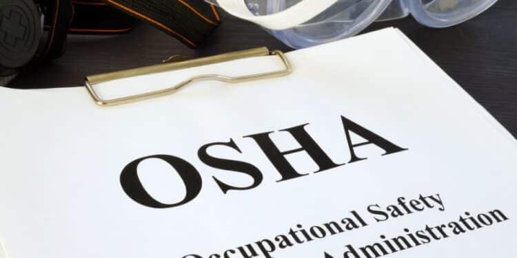 Clipboard with a paper that says "OSHA"