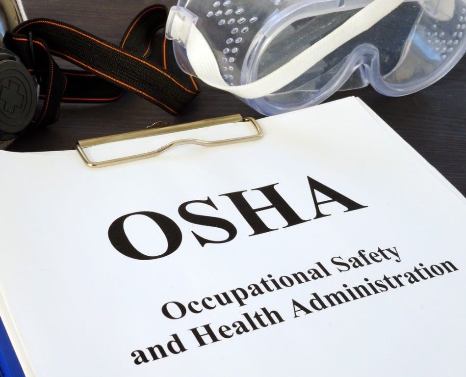 Clipboard with a paper that says "OSHA"