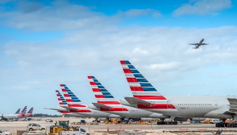A row of American Airlines airplanes at an airport