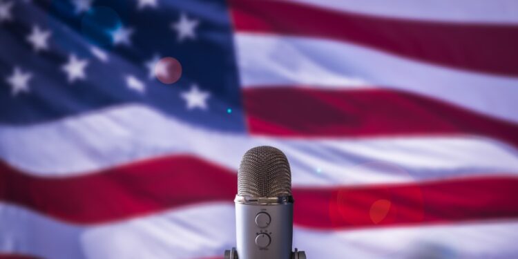 Microphone in front of an American flag