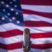 Microphone in front of an American flag