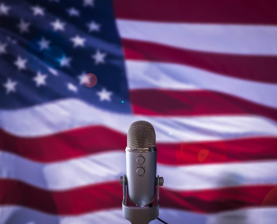 Microphone in front of an American flag